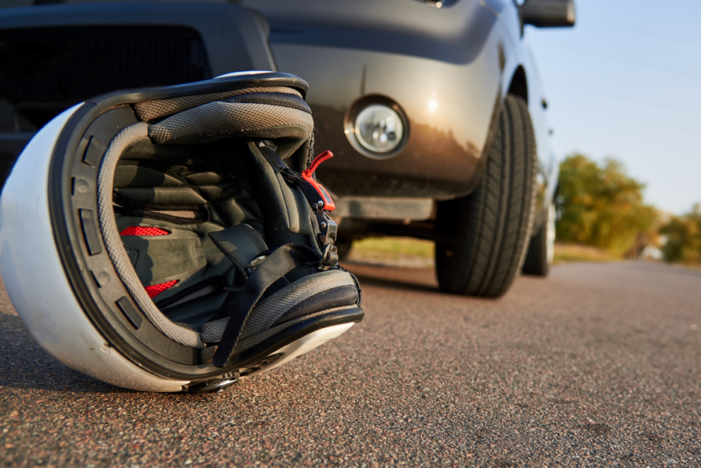 Motorcycle helmet on the road after a crash