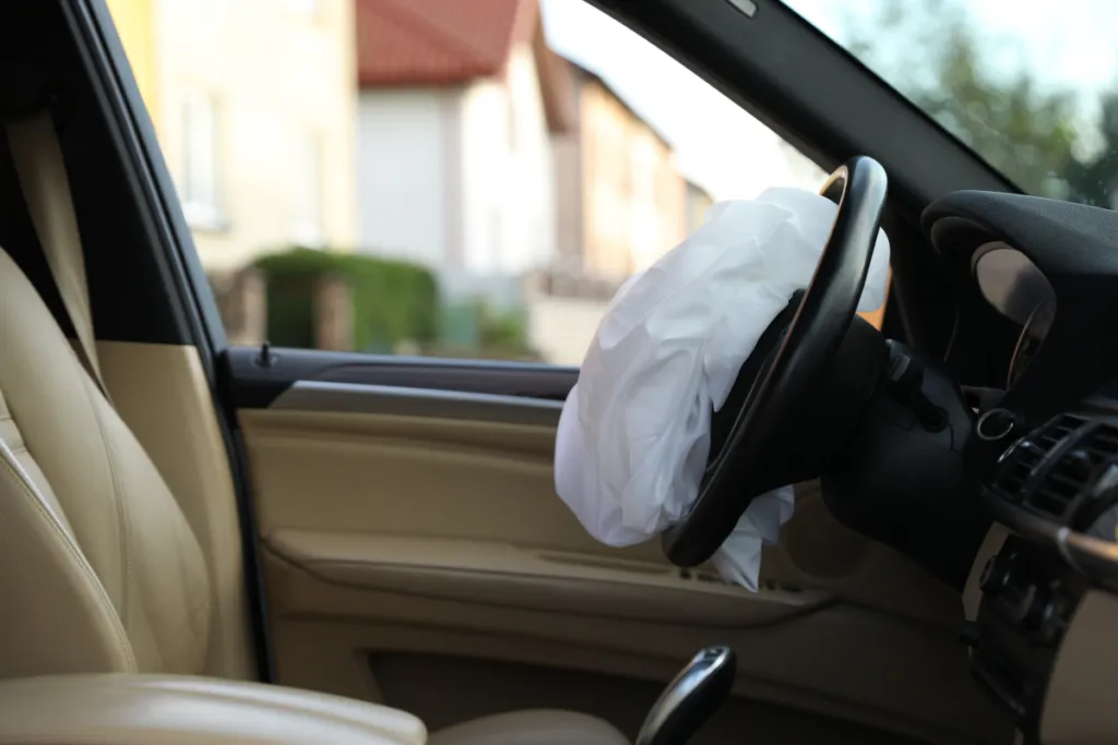 Deployed airbag inside a vehicle following a car accident